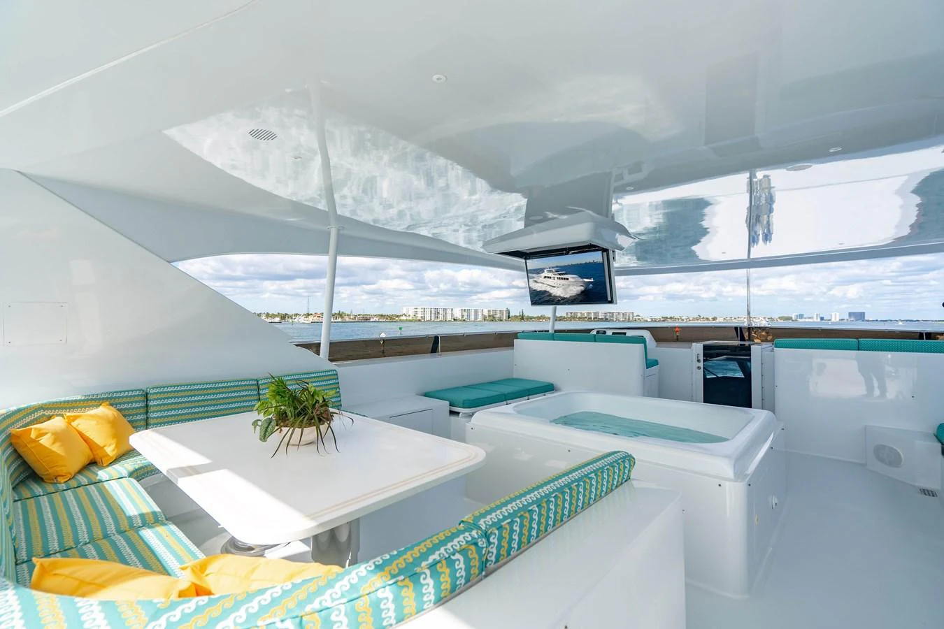 a room with a view of a snowy mountain and a pool aboard HOG HEAVEN Yacht for Sale