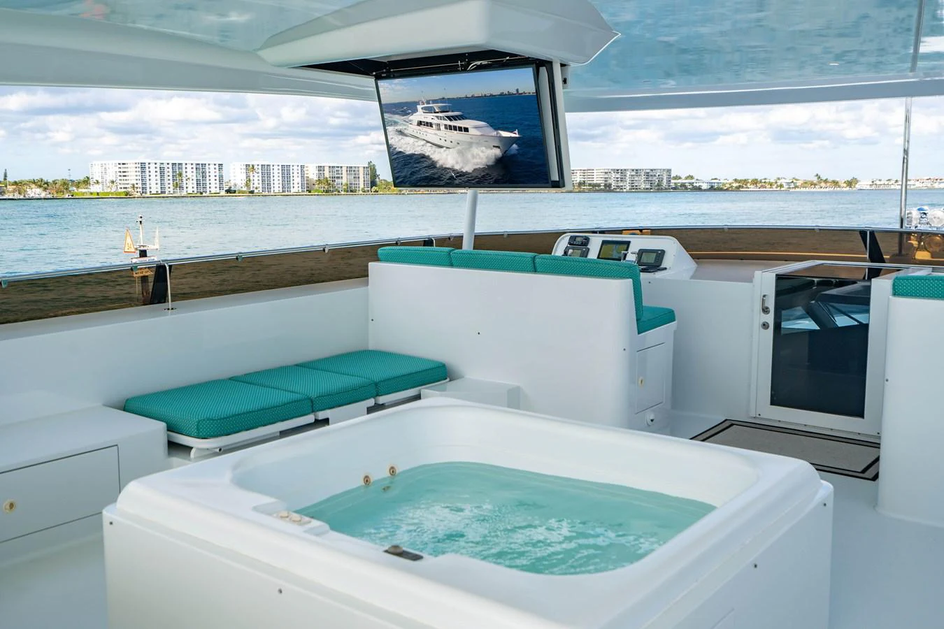 a large swimming pool in a large room with a large window aboard HOG HEAVEN Yacht for Sale