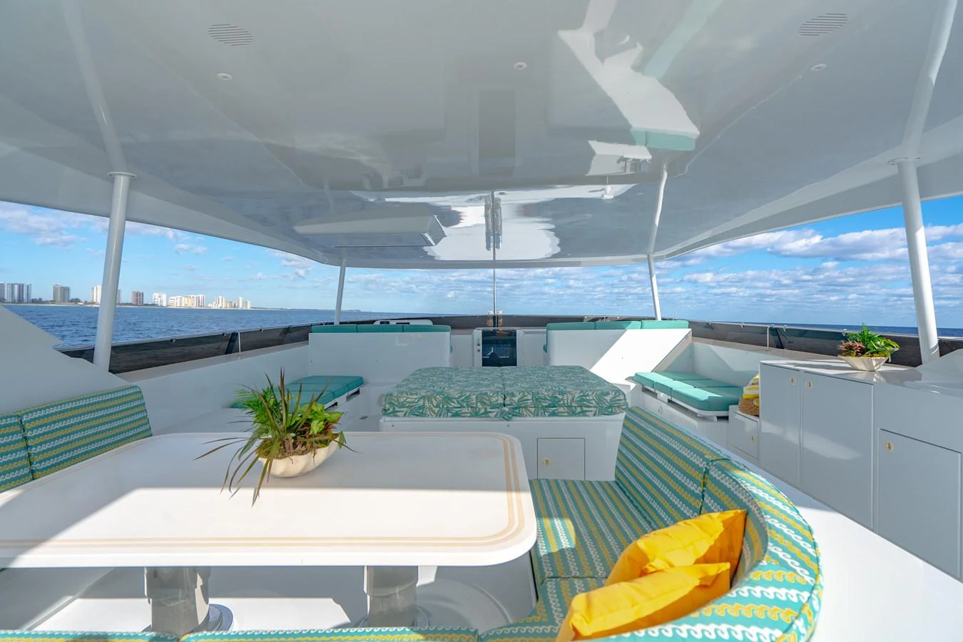 a room with a table and chairs aboard HOG HEAVEN Yacht for Sale
