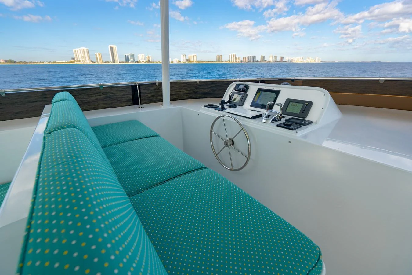 a boat with a fan and a view of a city aboard HOG HEAVEN Yacht for Sale