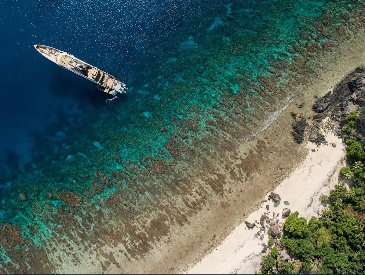 a boat in the water aboard AMELS 6004 Yacht for Sale
