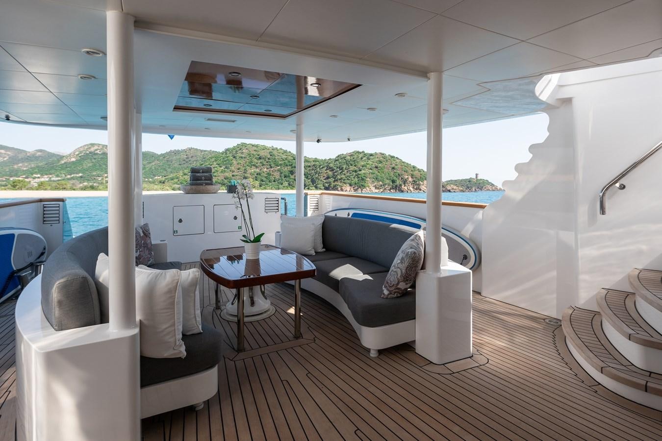 a living room with a large window aboard BERZINC Yacht for Charter