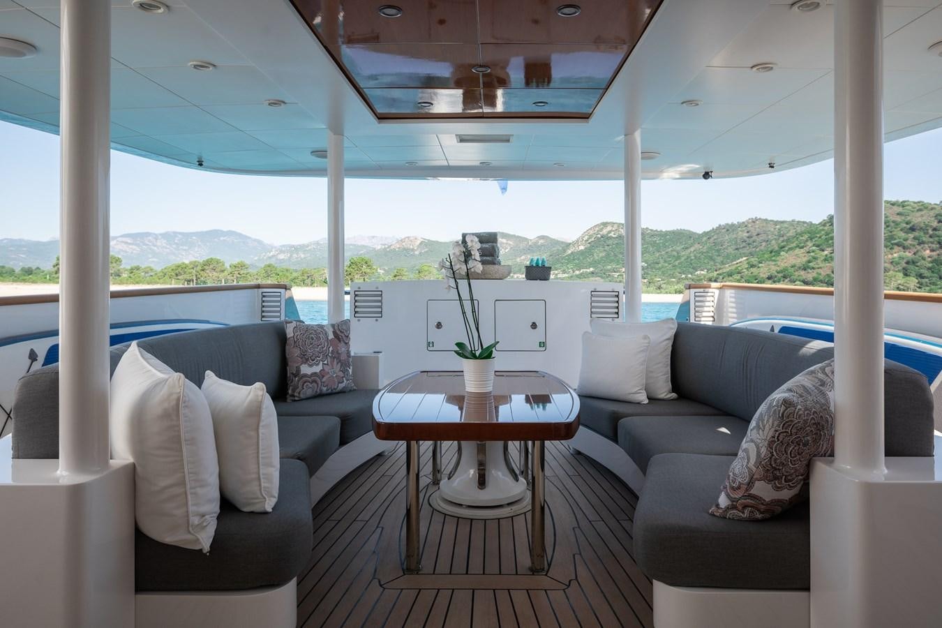 a living room with a large window aboard BERZINC Yacht for Charter