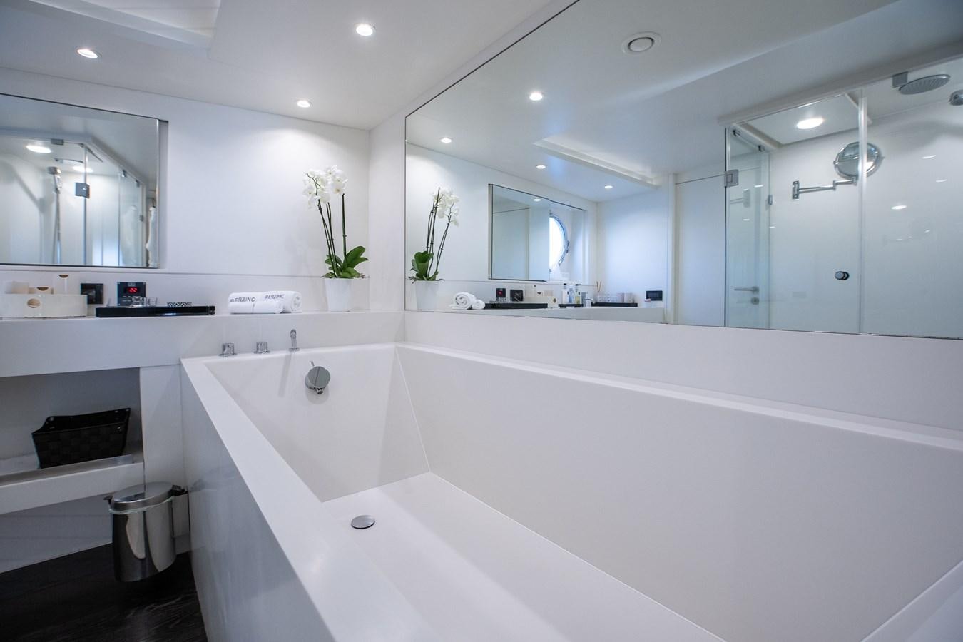 a large white bathroom aboard BERZINC Yacht for Charter