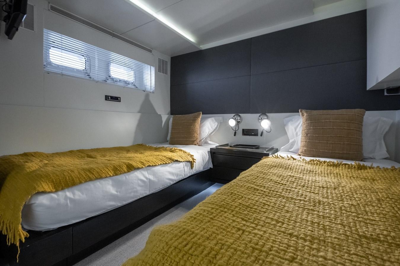 a couple of beds in a room aboard BERZINC Yacht for Charter