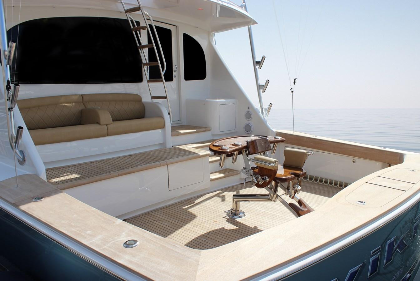 a boat with a table and chairs aboard NEW VIKING 72 CONVERTIBLE Yacht for Sale