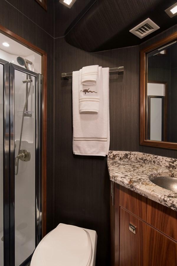 a bathroom with a sink and a toilet aboard NEW VIKING 72 CONVERTIBLE Yacht for Sale