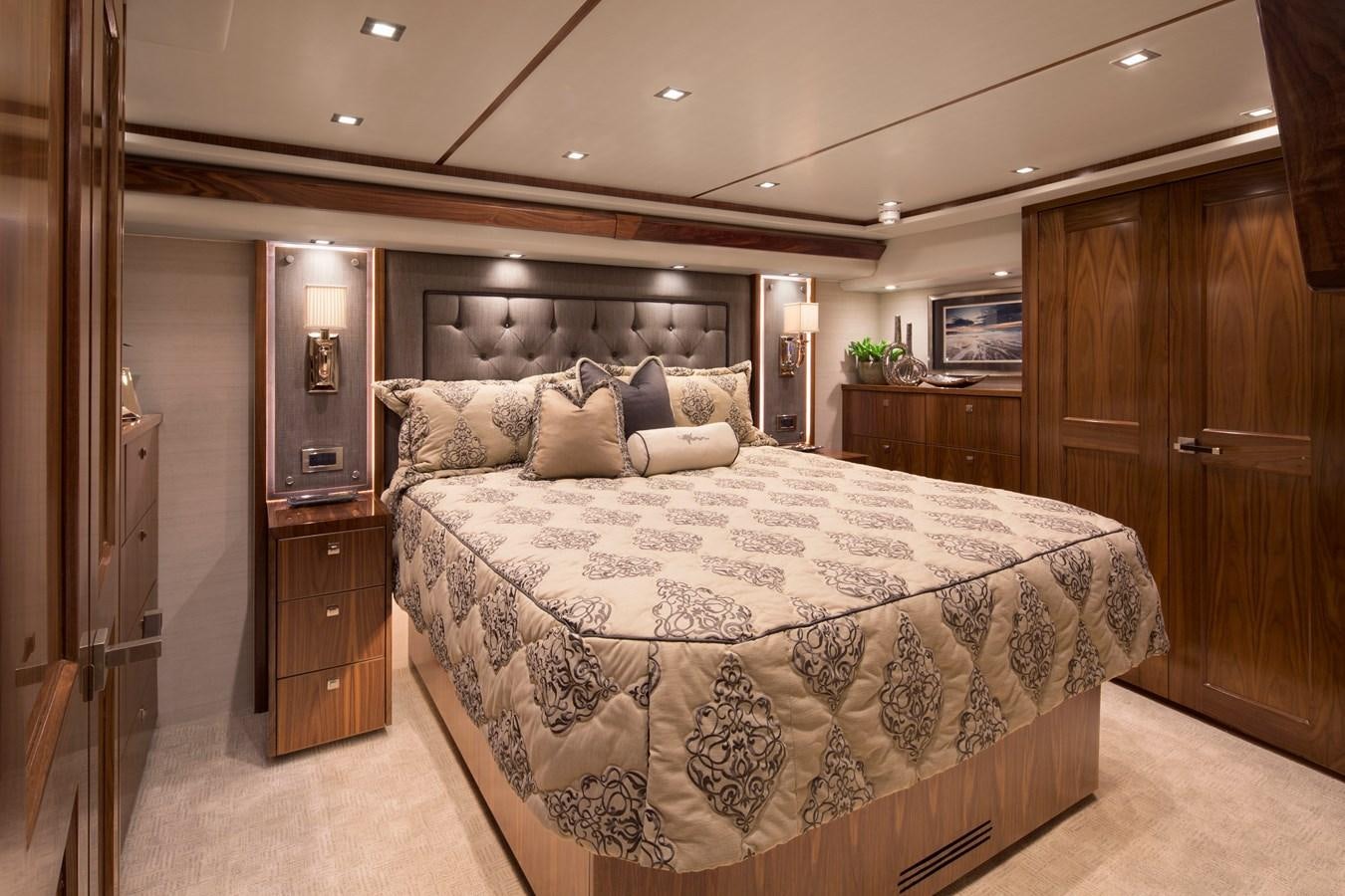 a large bed in a hotel room aboard NEW VIKING 72 CONVERTIBLE Yacht for Sale
