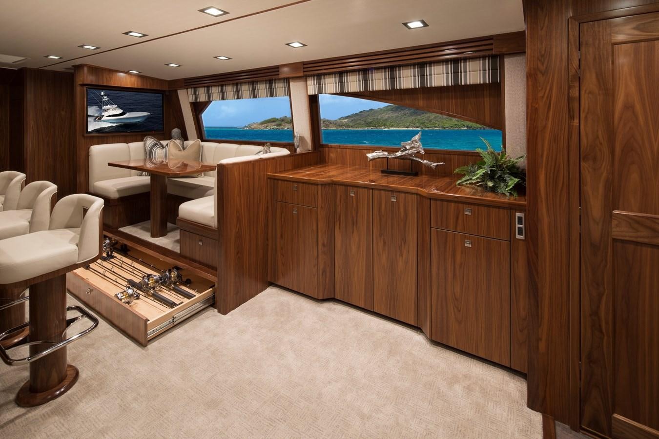 a room with a wood cabinet and a tv aboard NEW VIKING 72 CONVERTIBLE Yacht for Sale