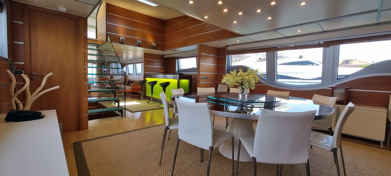 a room with tables and chairs aboard CHOO CHOO Yacht for Sale