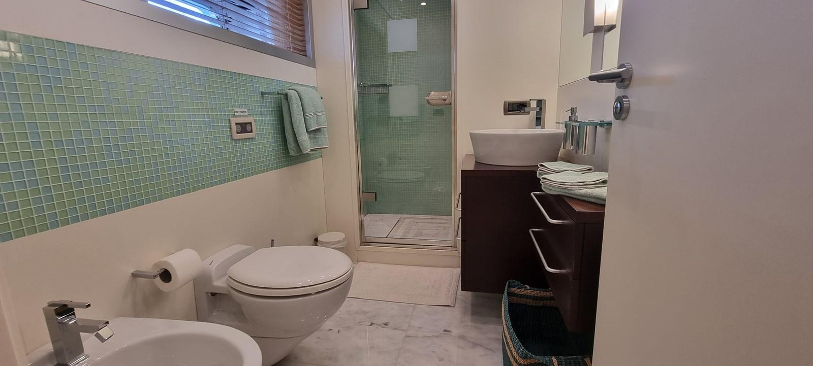 a bathroom with a sink toilet and a bathtub aboard CHOO CHOO Yacht for Sale