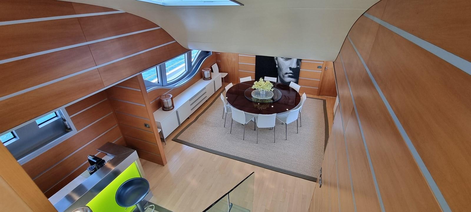 a room with a table and chairs aboard CHOO CHOO Yacht for Sale