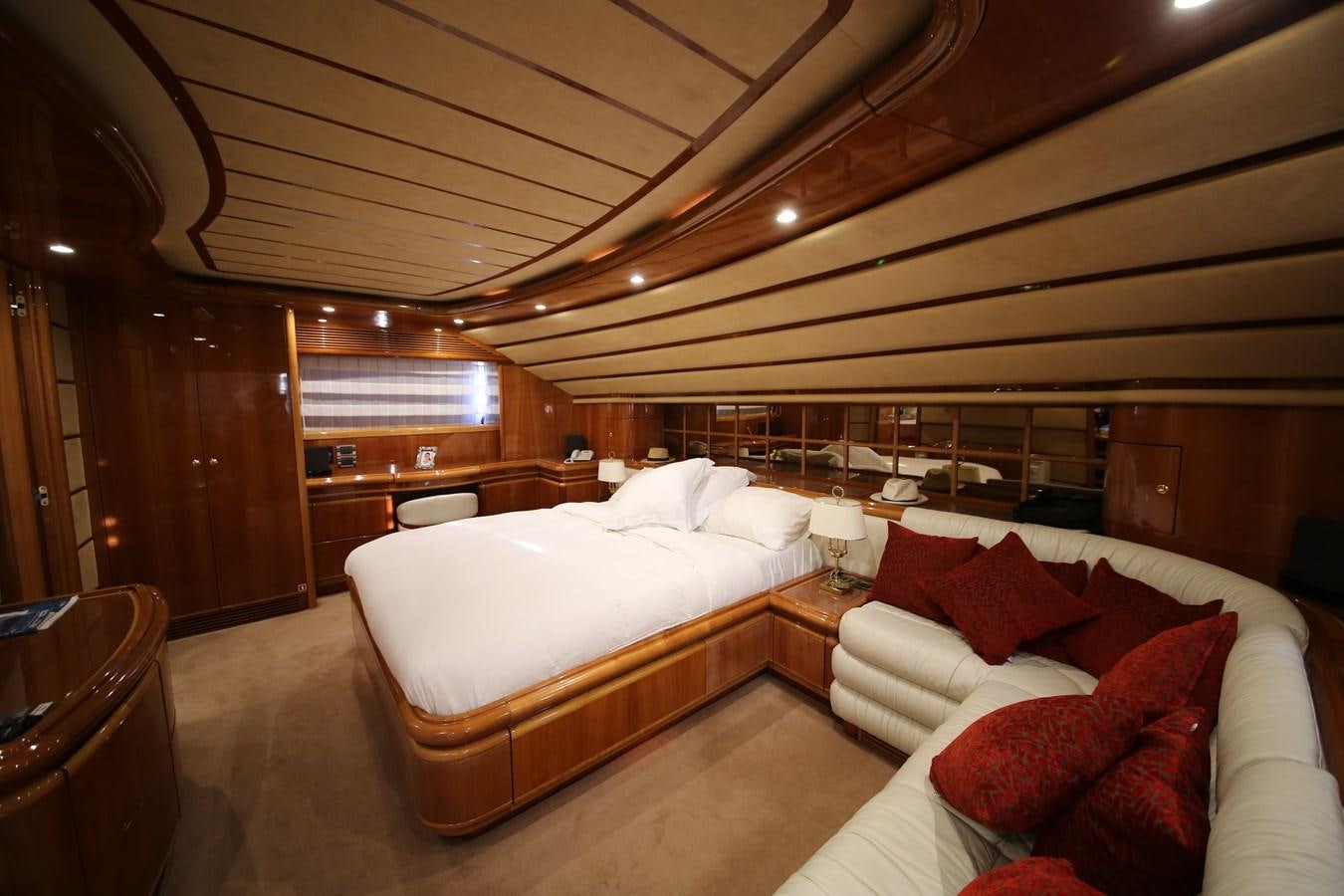 a room with a bed and a couch aboard YOLO TOO Yacht for Sale