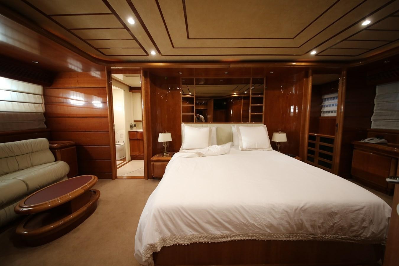 a large bed in a room aboard YOLO TOO Yacht for Sale