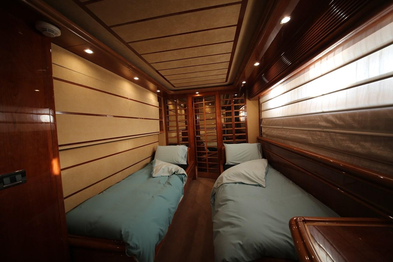 a room with a bed and a window aboard YOLO TOO Yacht for Sale