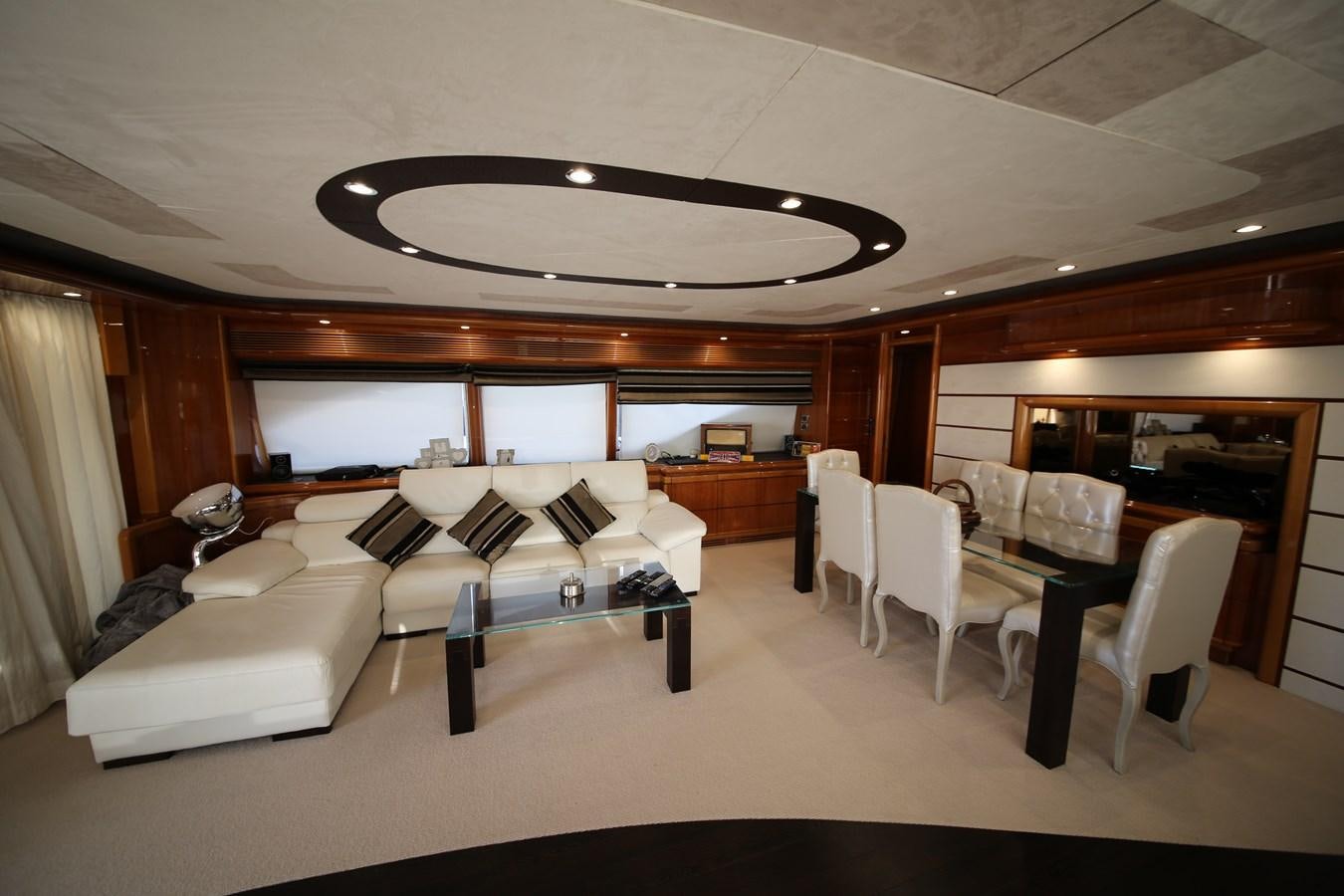 a living room with a couch and a table aboard YOLO TOO Yacht for Sale