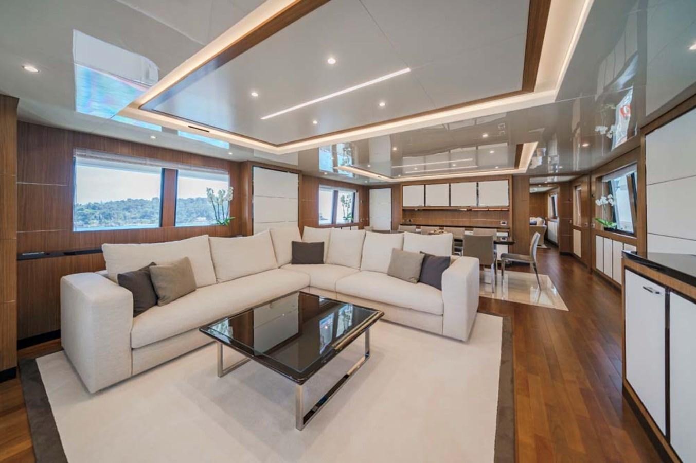 a living room with a couch and a coffee table aboard FIORENTE Yacht for Charter