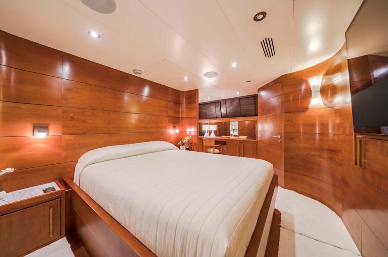 a room with a bed and a wood wall aboard FIORENTE Yacht for Charter