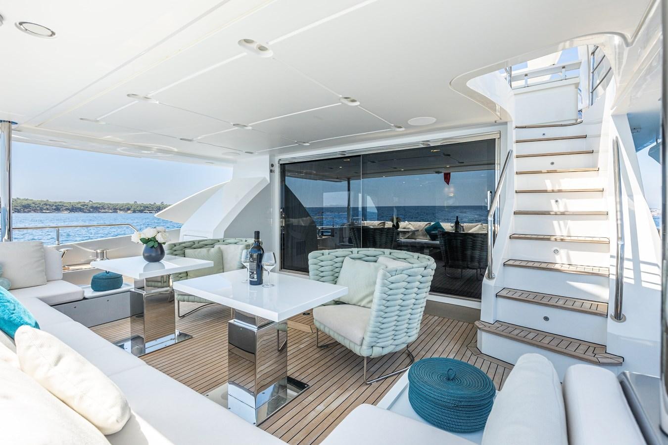 a modern looking living room with a large open window aboard ANASTASIA V Yacht for Sale