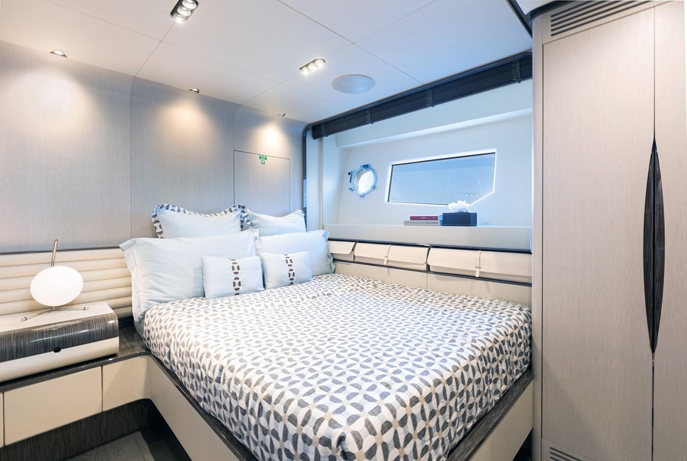 a room with a bed and a window aboard ANASTASIA V Yacht for Sale