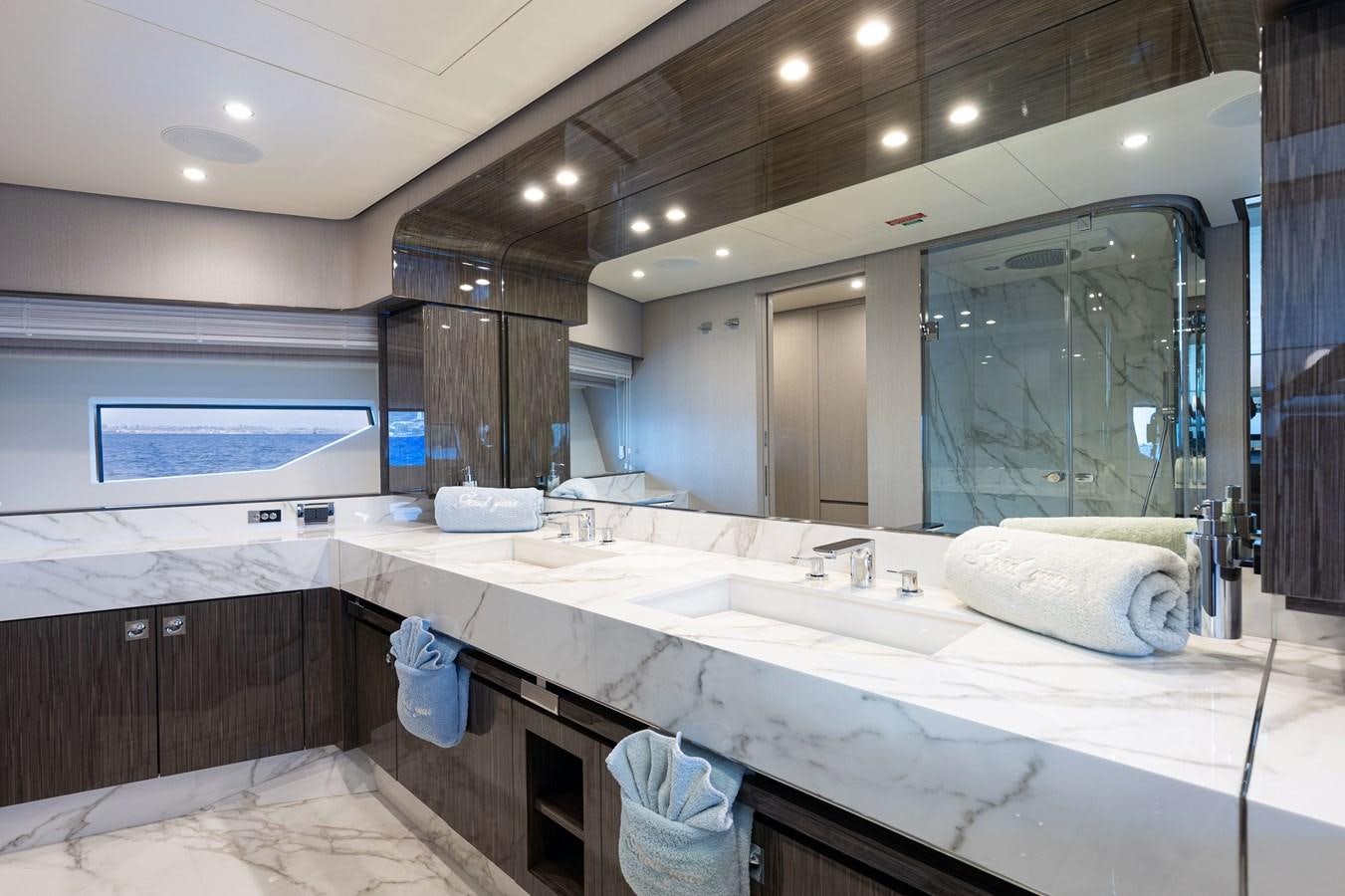 a bathroom with a large mirror aboard ANASTASIA V Yacht for Sale