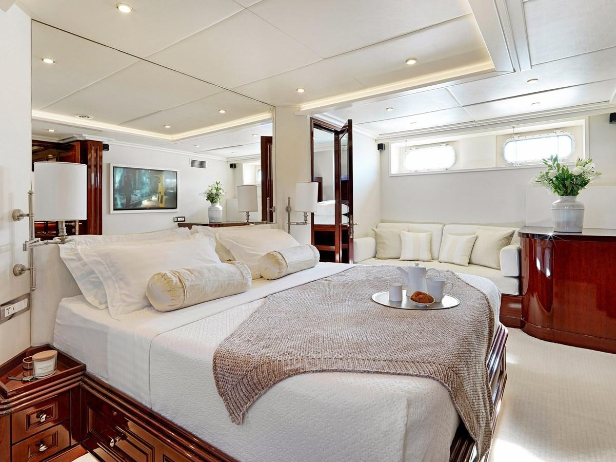 a large white bed in a room aboard MIA ZOI Yacht for Sale