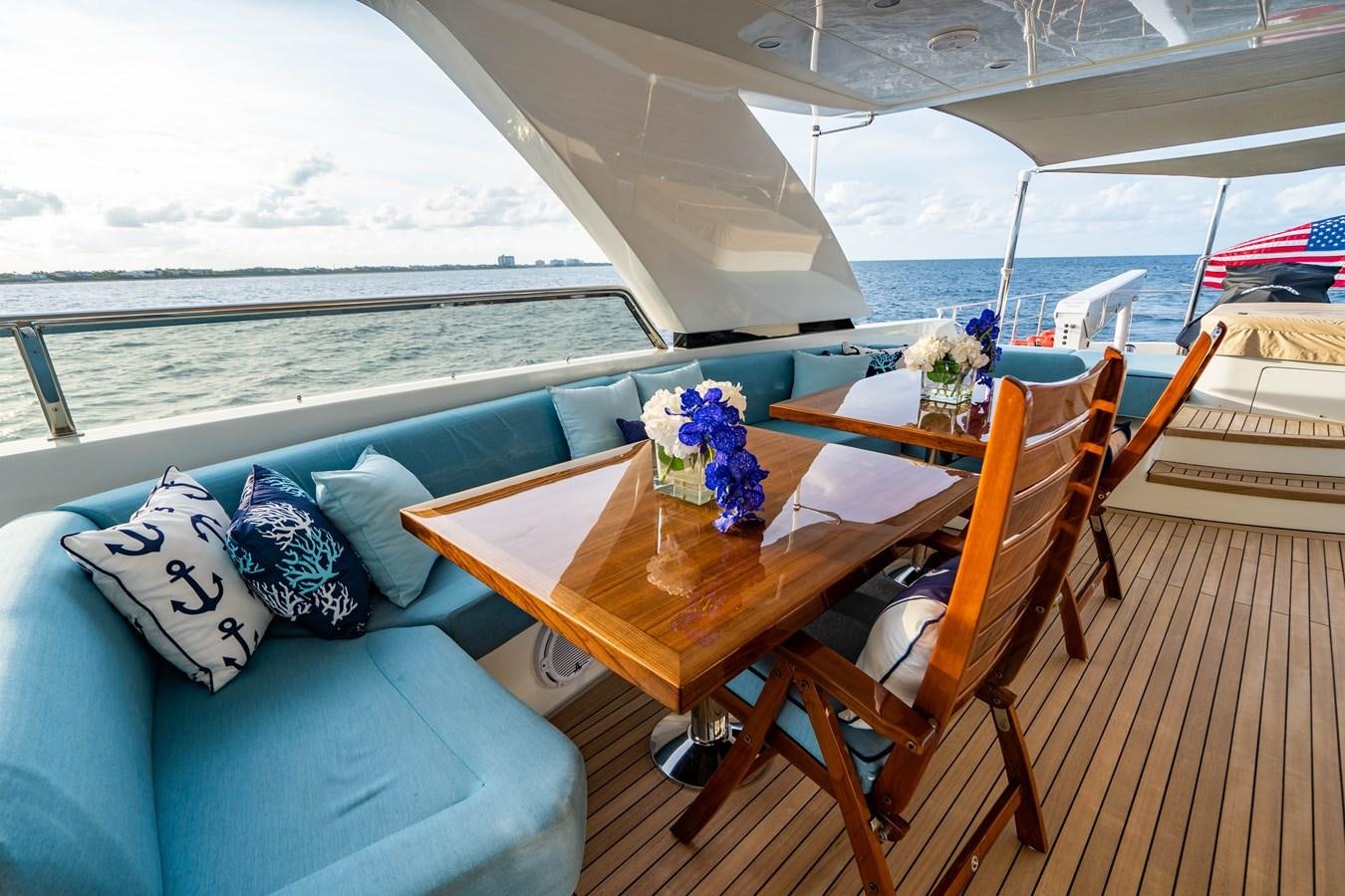 a table with chairs on it aboard PICO Yacht for Sale