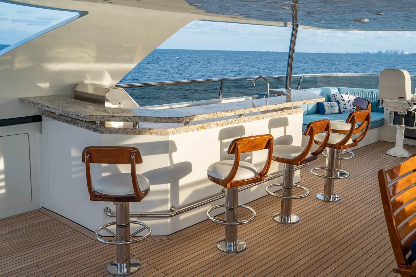 a room with chairs and tables aboard PICO Yacht for Sale