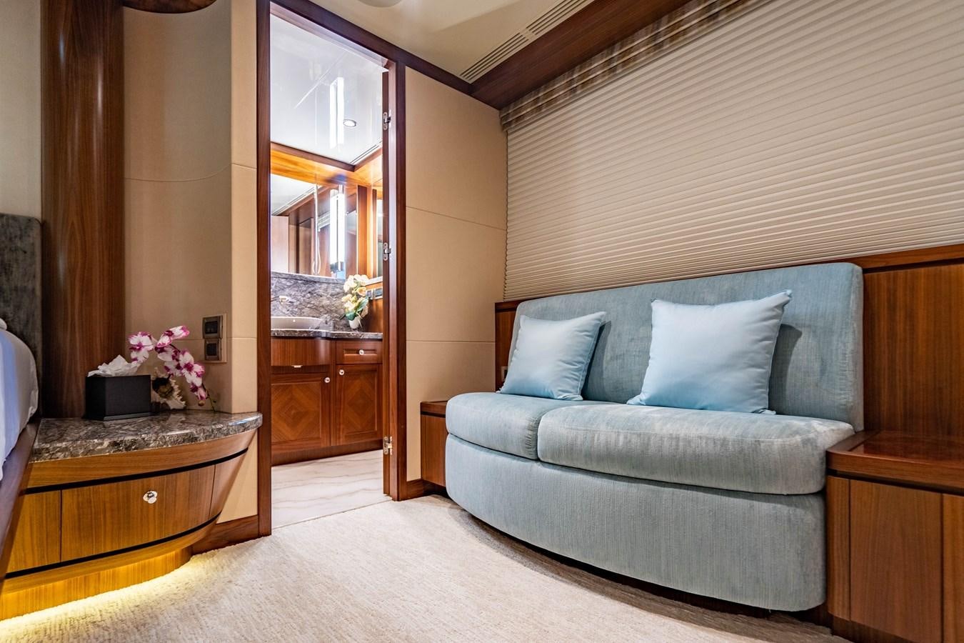 a room with a bed and a desk aboard PICO Yacht for Sale