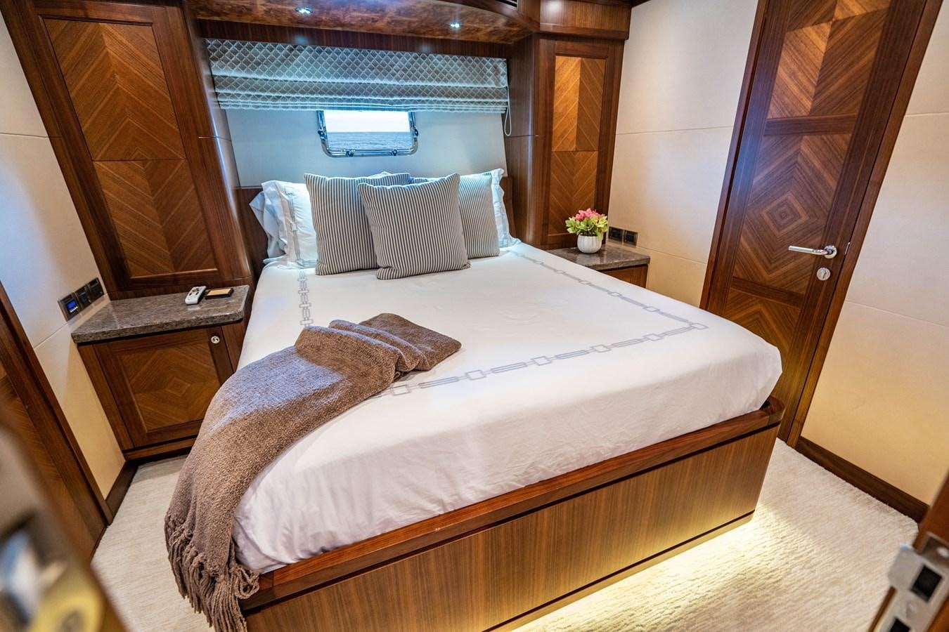 a bed with white sheets aboard PICO Yacht for Sale