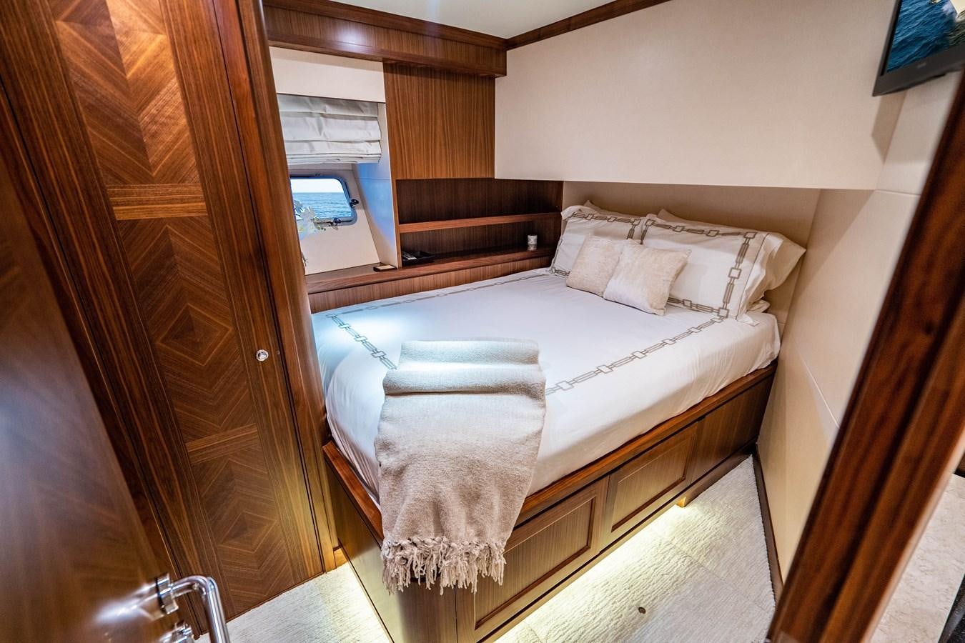 a bed with white sheets aboard PICO Yacht for Sale