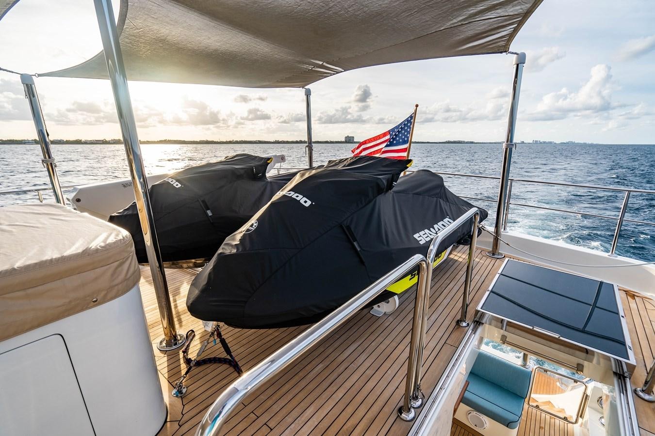 a boat with a flag on the front aboard PICO Yacht for Sale