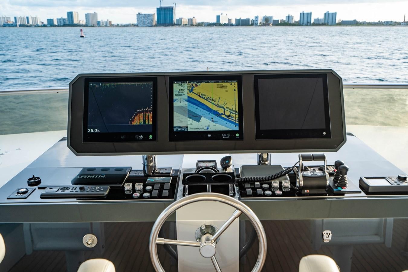 a desk with a computer and other electronics on it aboard PICO Yacht for Sale
