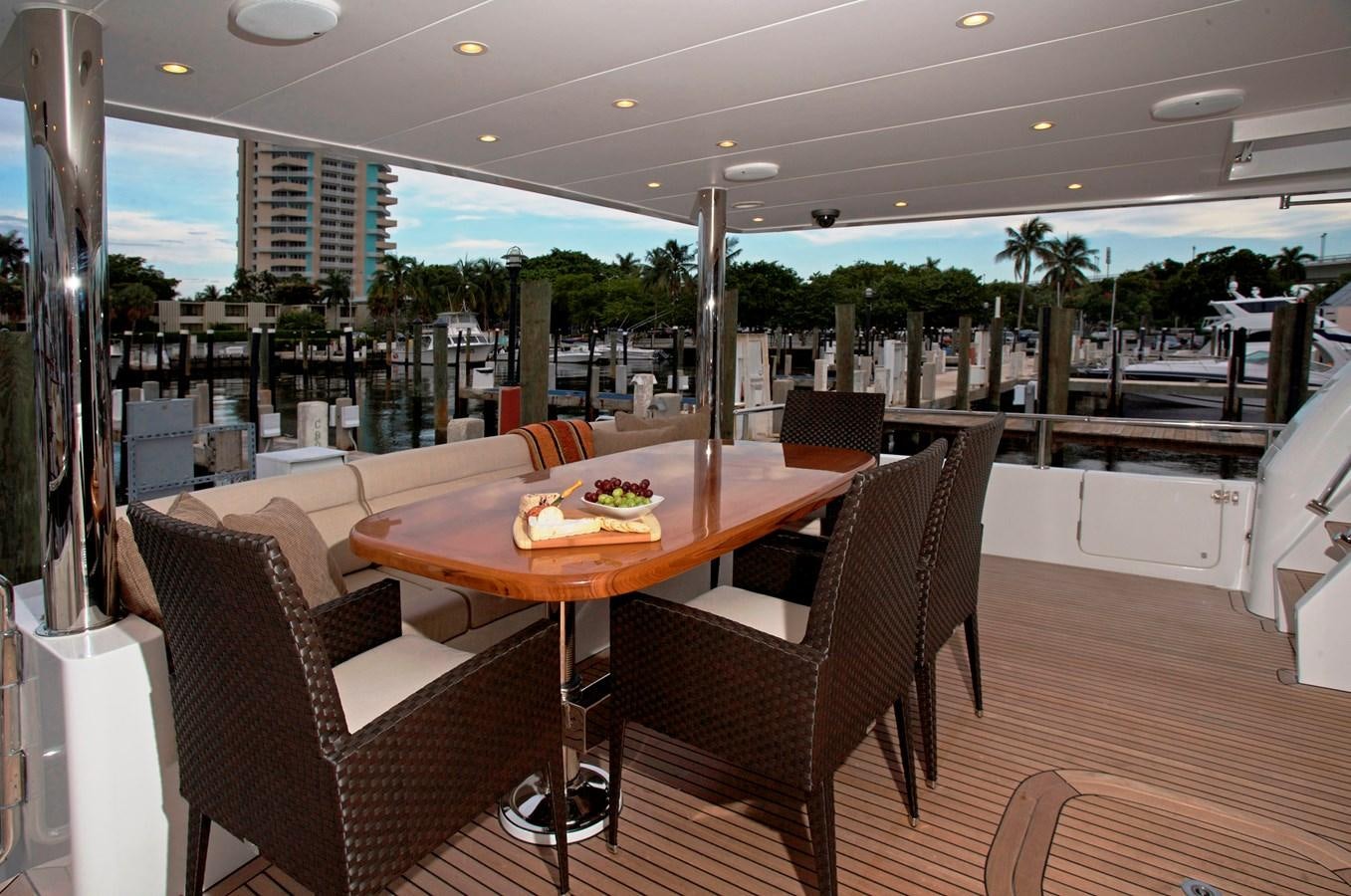 a table and chairs in a room aboard LADY C II Yacht for Sale