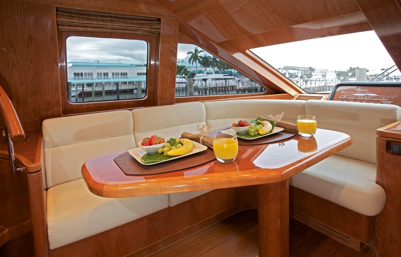 a table with food on it aboard LADY C II Yacht for Sale