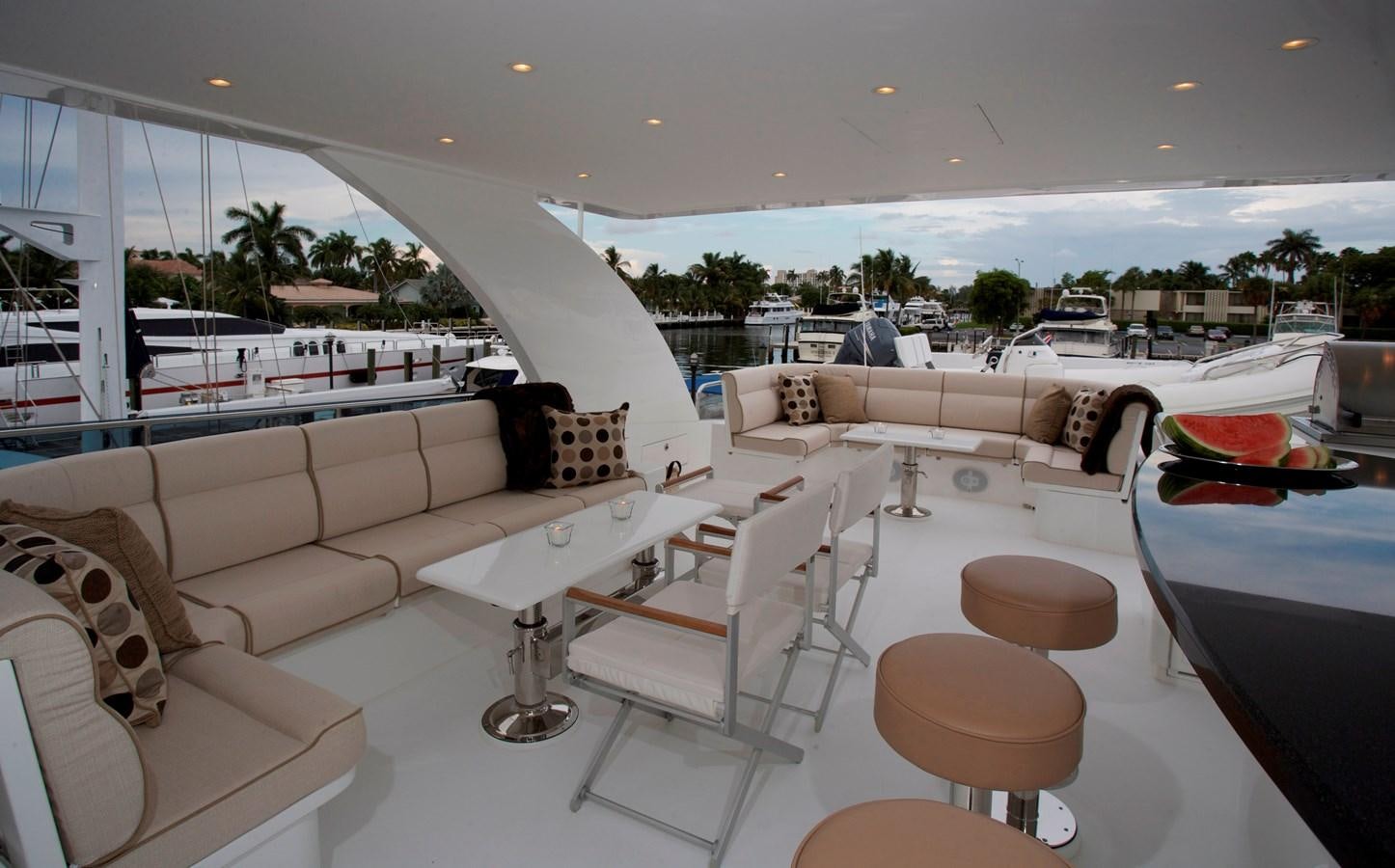 a room with a couch and a table and chairs aboard LADY C II Yacht for Sale