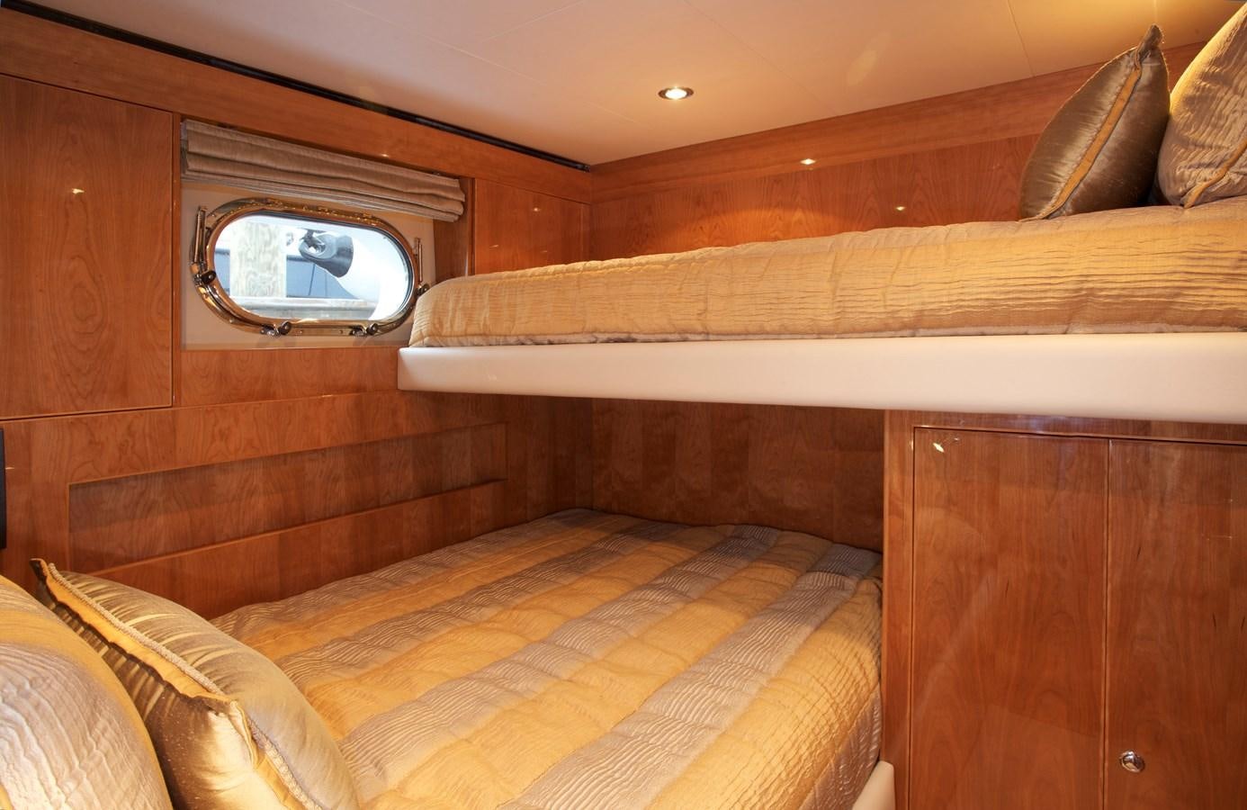 a bed with a mirror above it aboard LADY C II Yacht for Sale