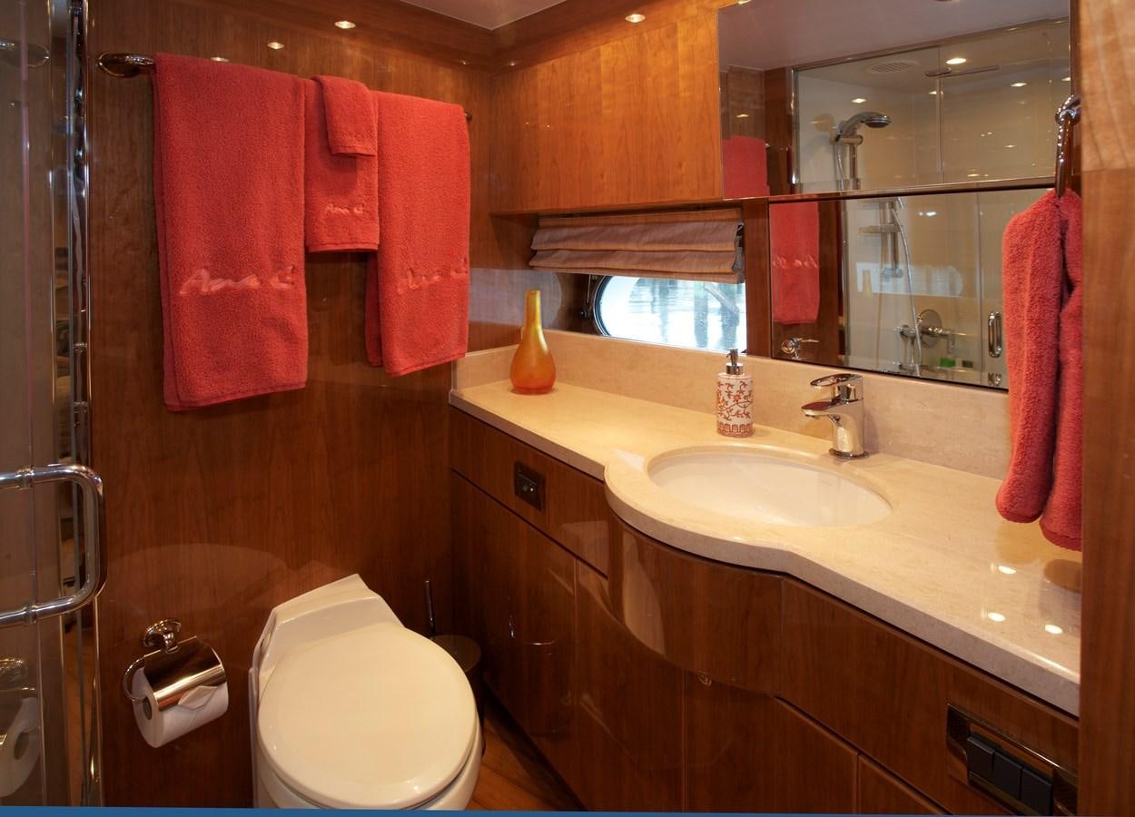 a bathroom with red towels aboard LADY C II Yacht for Sale