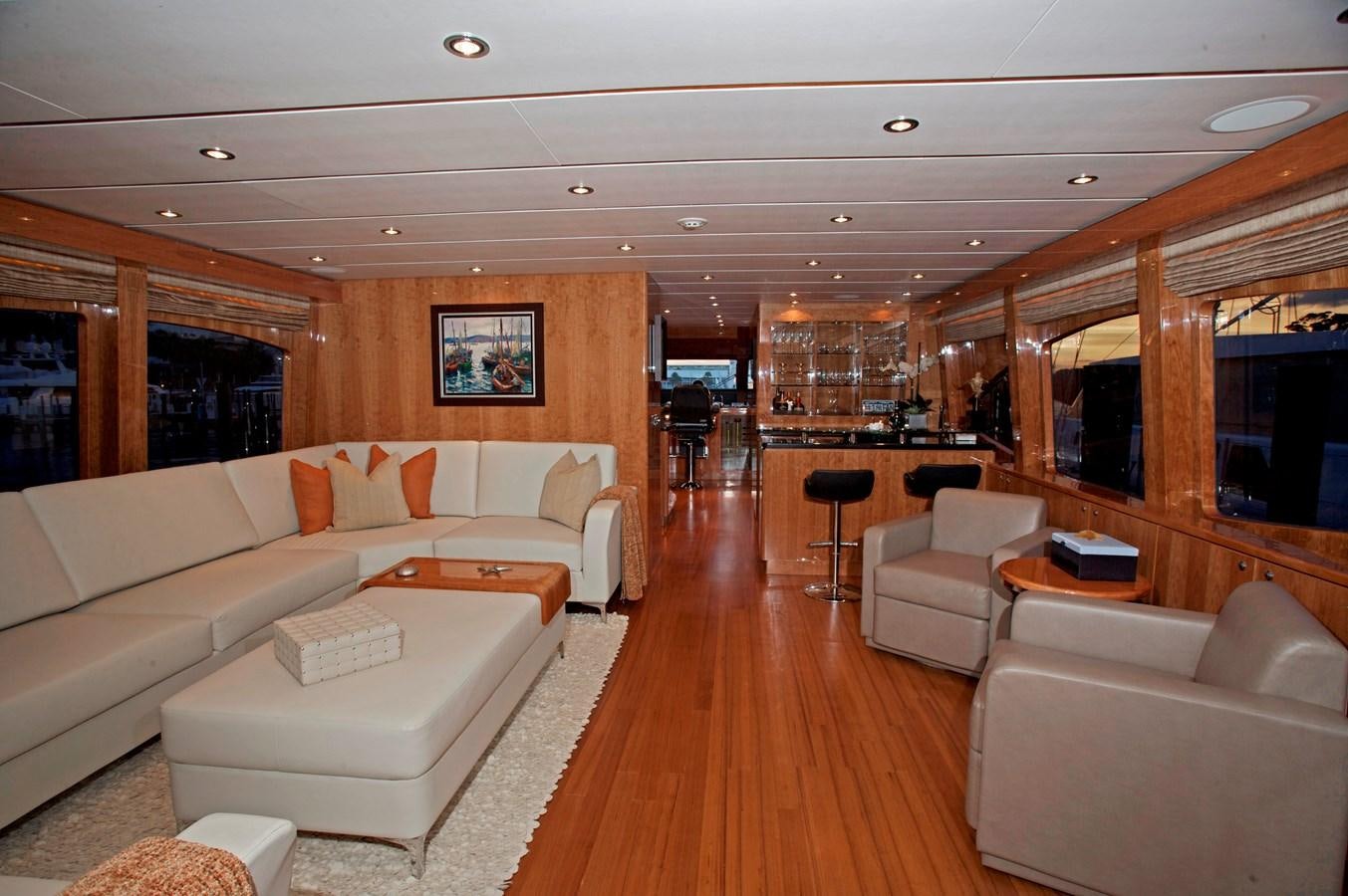 a living room with a large sofa aboard LADY C II Yacht for Sale