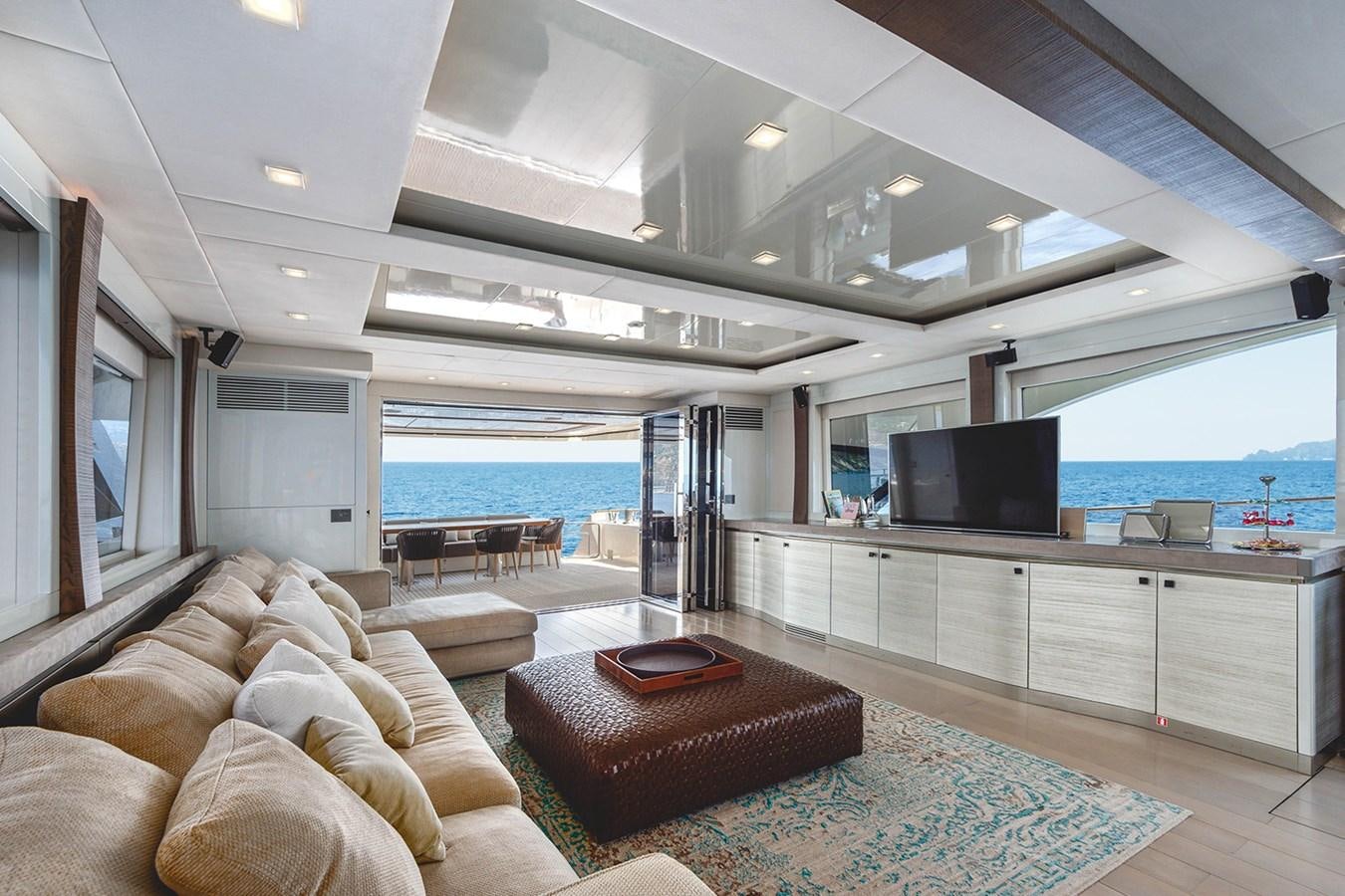 a living room with a large window aboard GV Yacht for Sale