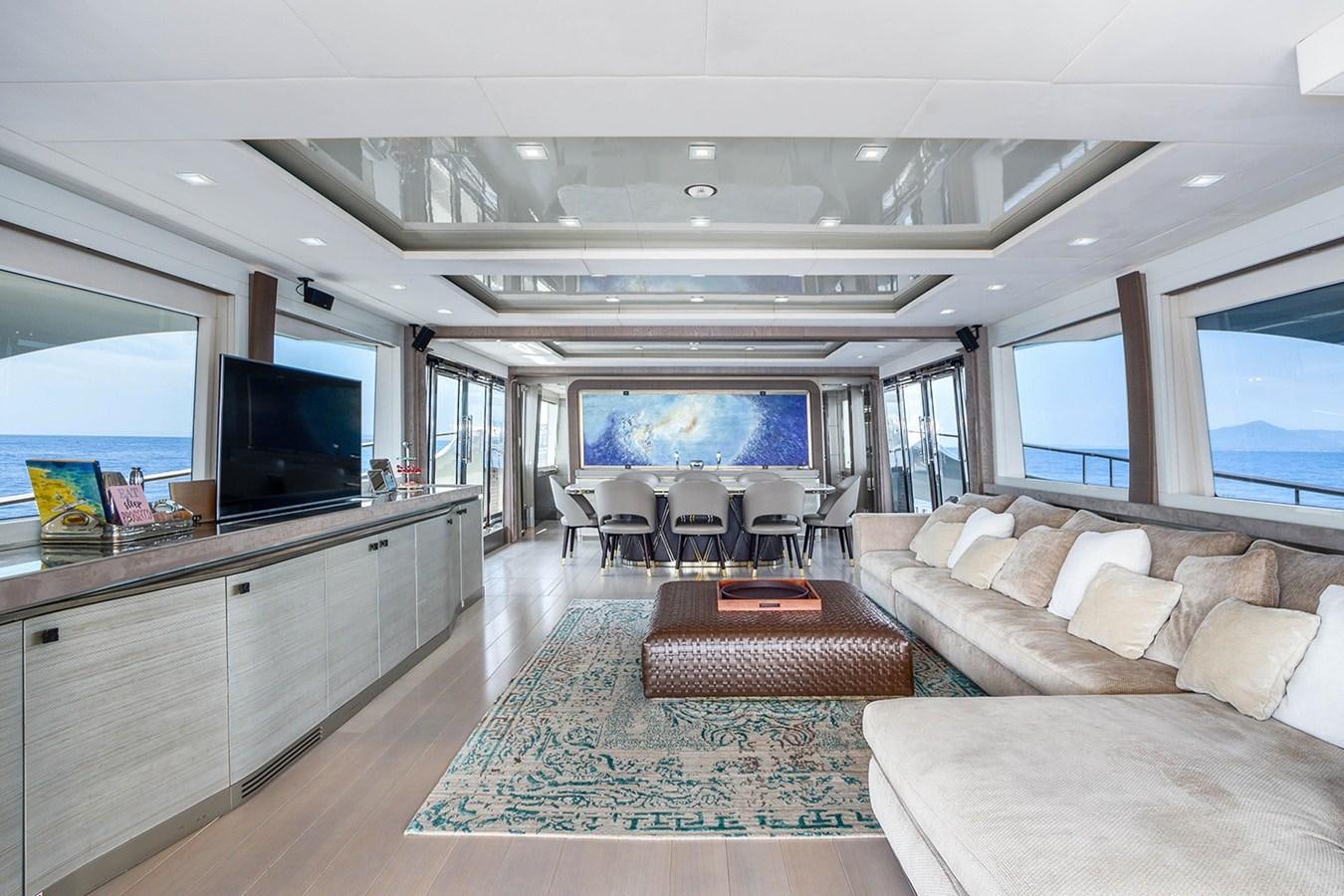 a living room with a large window aboard GV Yacht for Sale