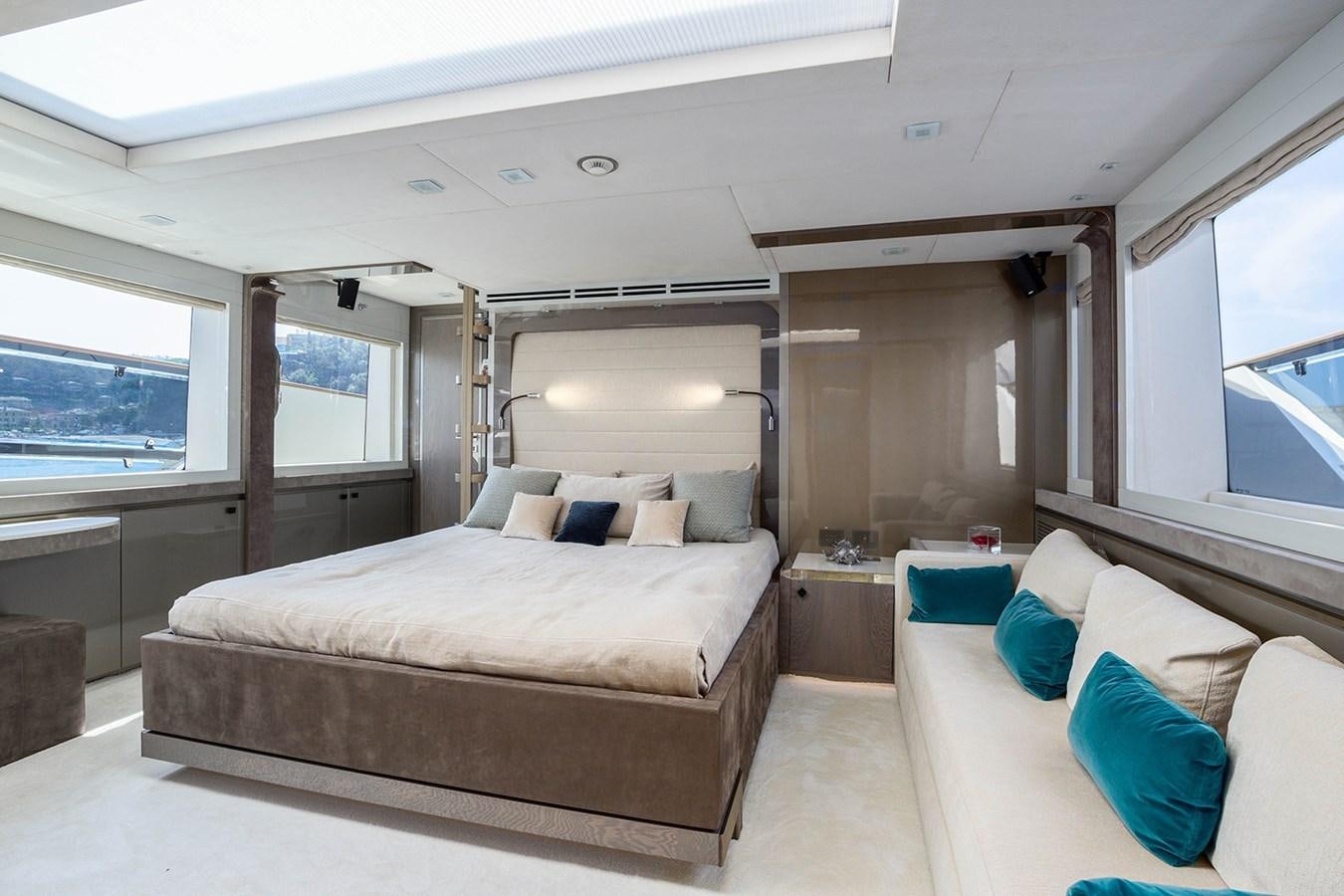a room with a bed and a window aboard GV Yacht for Sale
