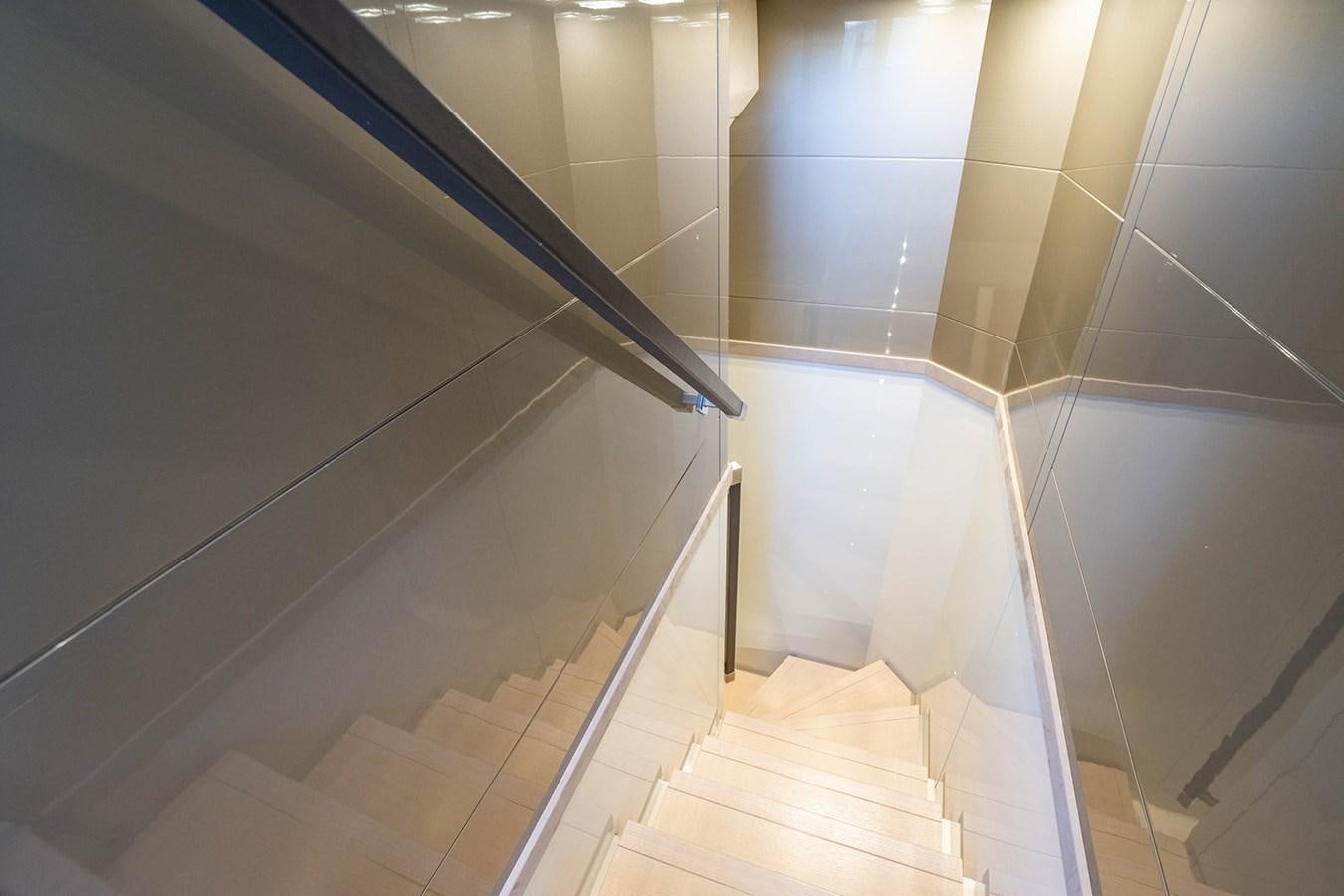 a tiled bathroom with a glass shower aboard GV Yacht for Sale