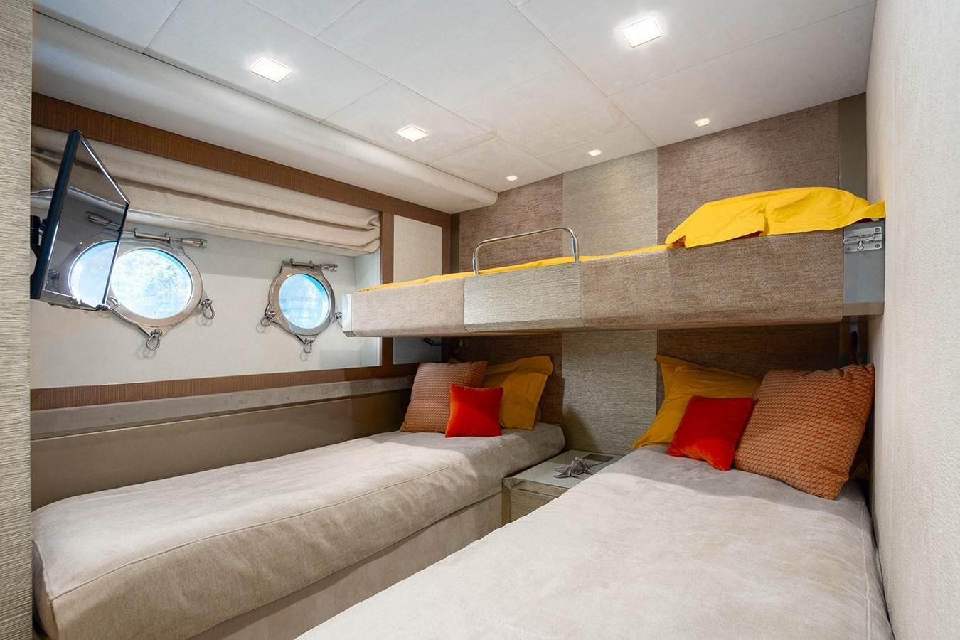 a room with beds and a mirror aboard GV Yacht for Sale