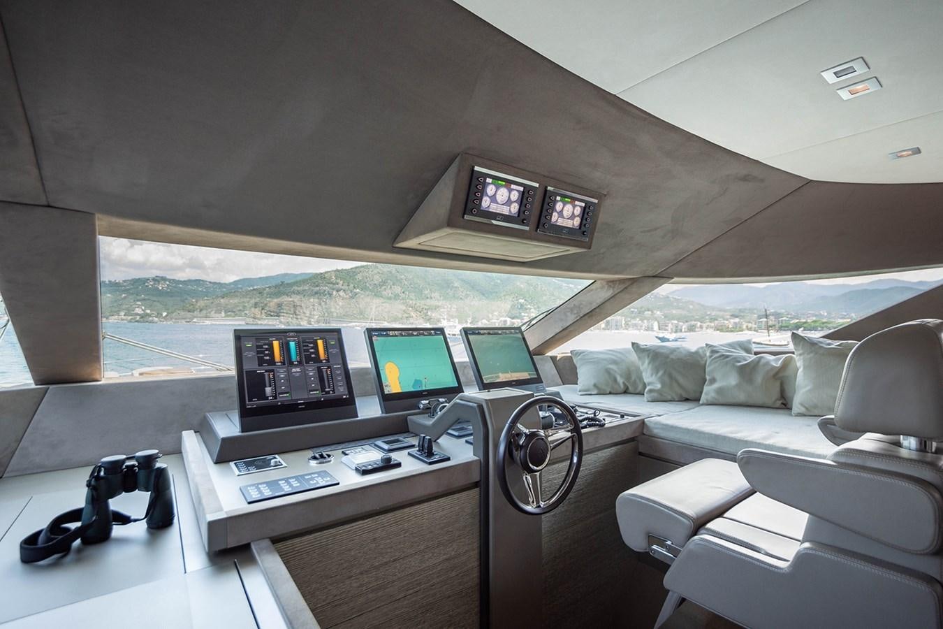 a room with a couch and computers aboard GV Yacht for Sale