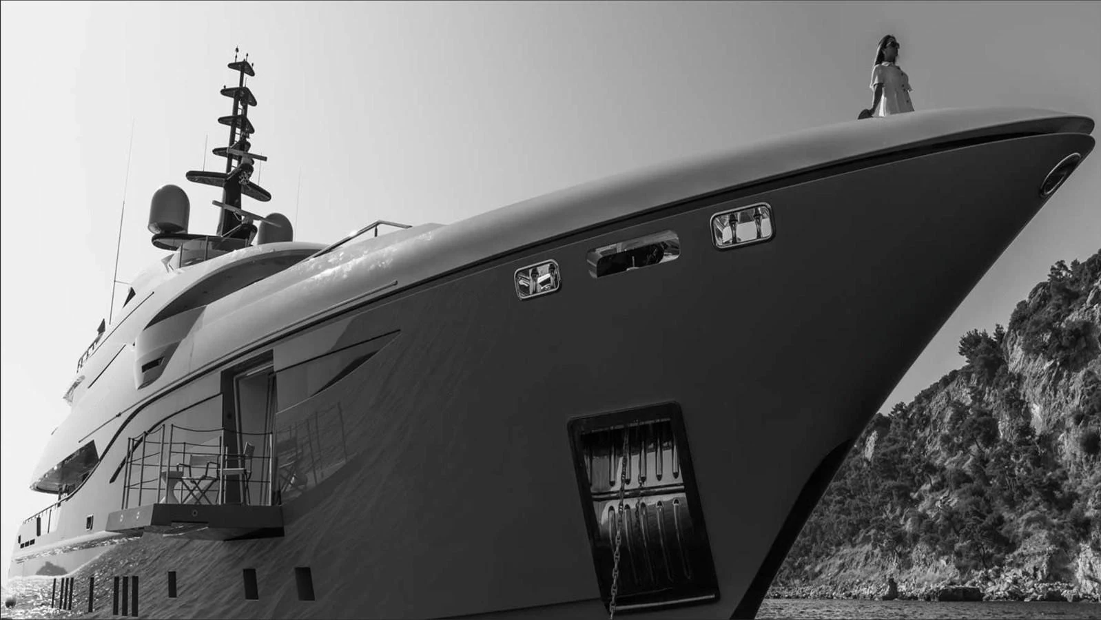 a large ship with a person standing on the deck aboard MOONRAKER Yacht for Sale