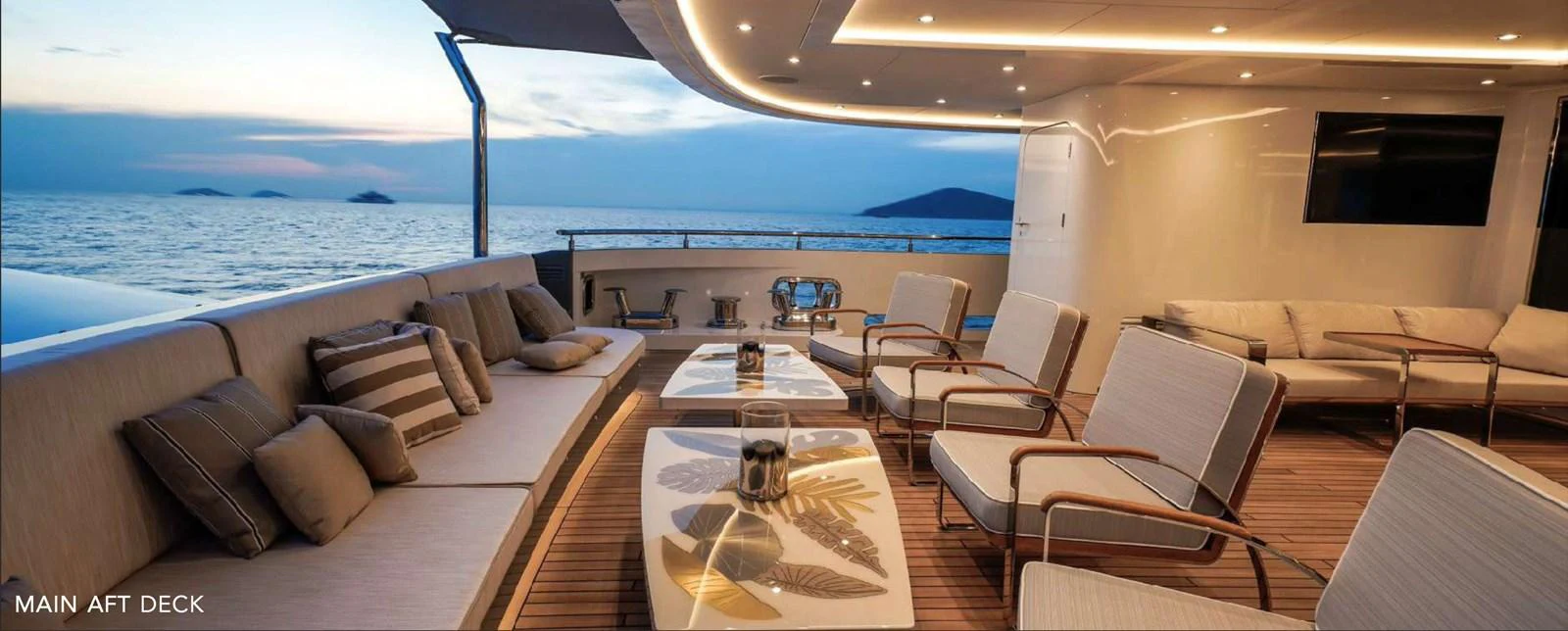 a large boat with a table and chairs on it aboard MOONRAKER Yacht for Sale
