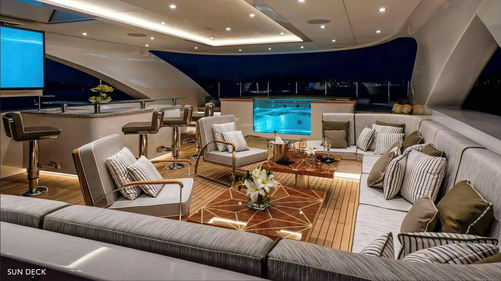 a living room with a large screen aboard MOONRAKER Yacht for Sale
