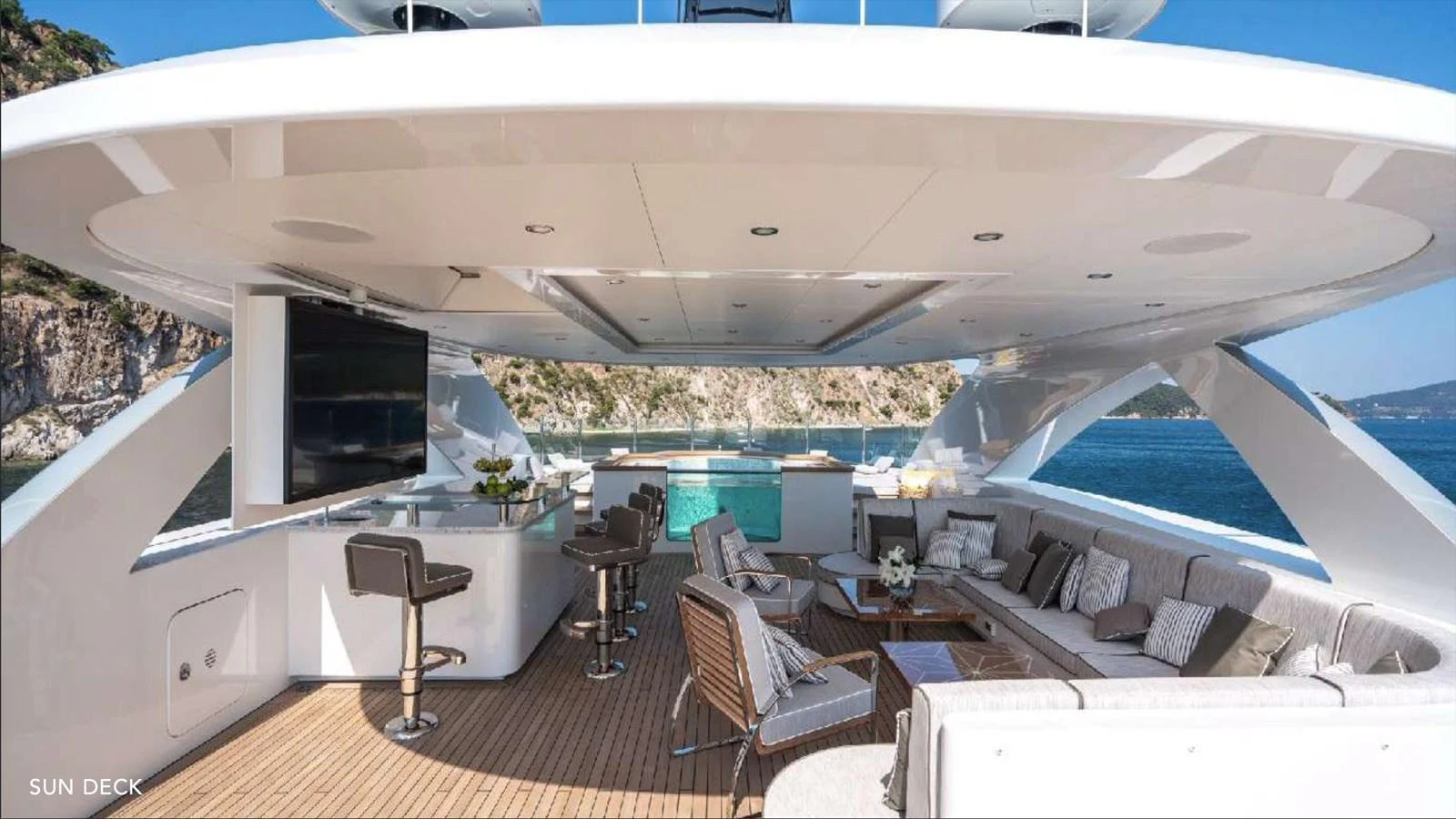 a room with a large deck and a pool aboard MOONRAKER Yacht for Sale