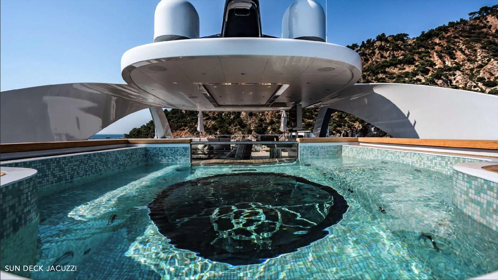 a white space shuttle above a pool of water aboard MOONRAKER Yacht for Sale